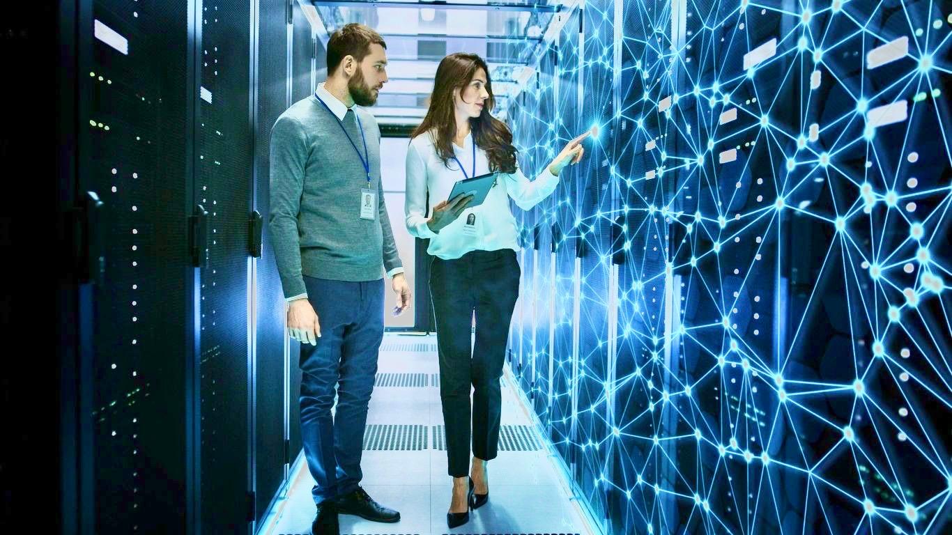 IT professionals reviewing a network in a data center